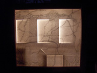 SUYOUNG KIM - Maison, 35 x 28 x 15cm, 2005, Mine sur carton de parfum dans la boîte lumière. SUYOUNG KIM - Maison, 35 x 28 x 15cm, 2005, Mine sur carton de parfum dans la boîte lumière.