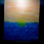 Le coucher de soleil et la mer