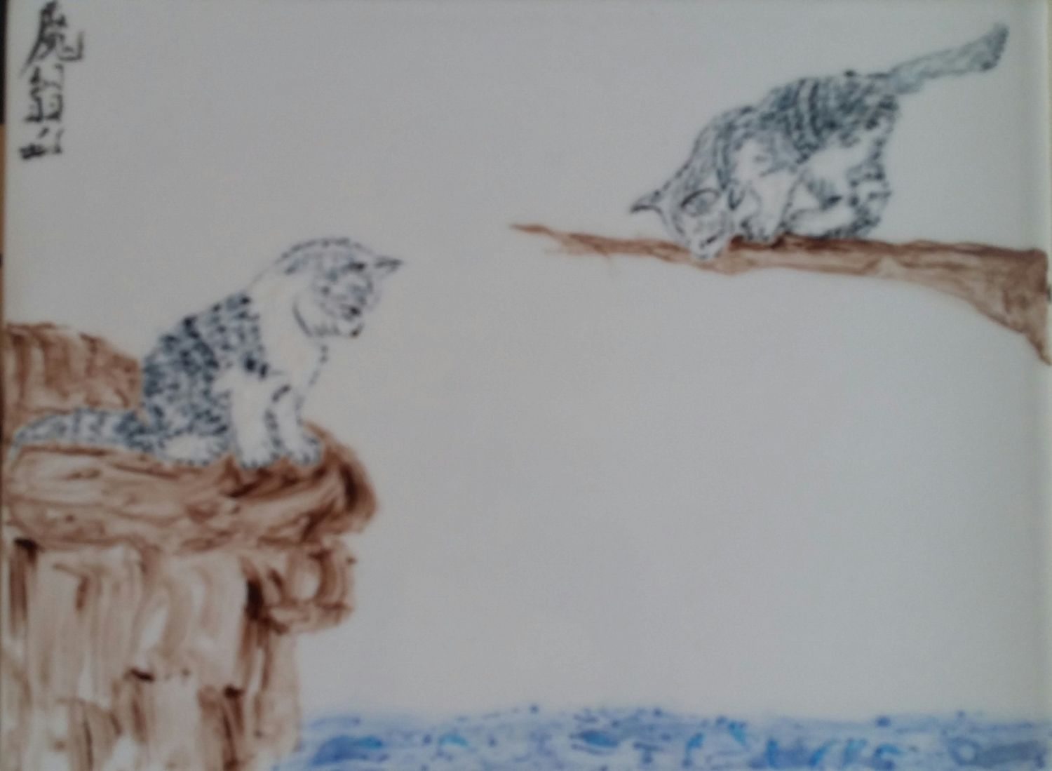 deux-chats-guettant-les-poissons